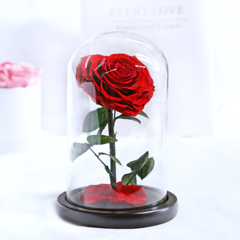 Heart-shaped eternal flowers in a small prince glass-covered gift  preserved flowers with glass dome