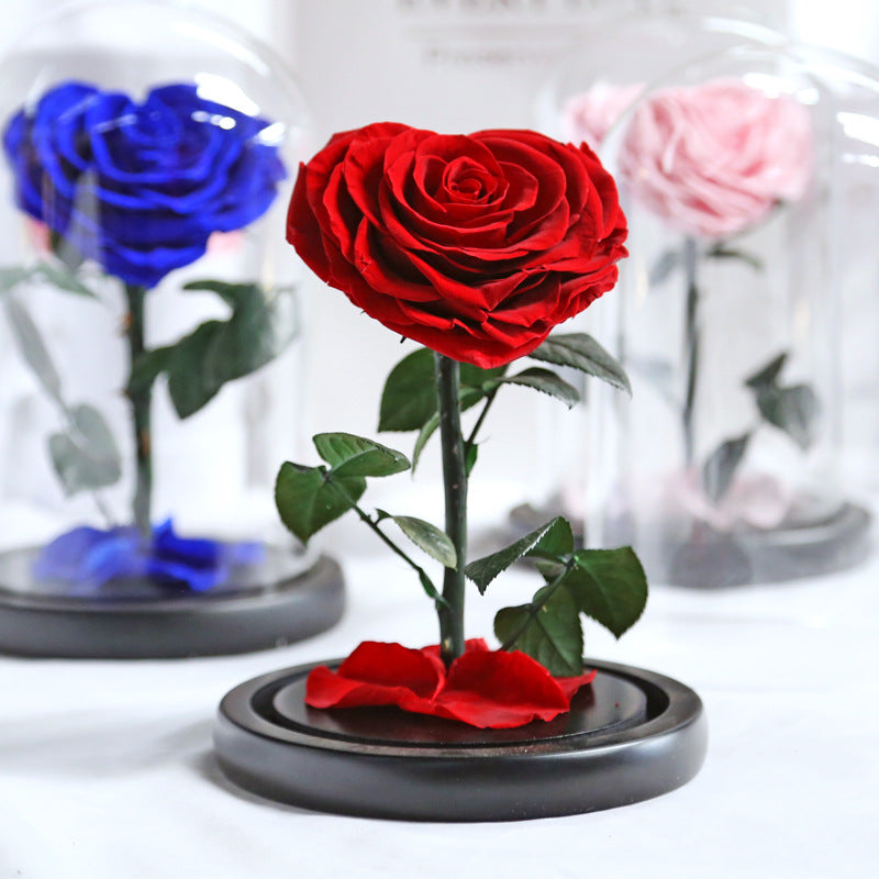 Heart-shaped eternal flowers in a small prince glass-covered gift  preserved flowers with glass dome