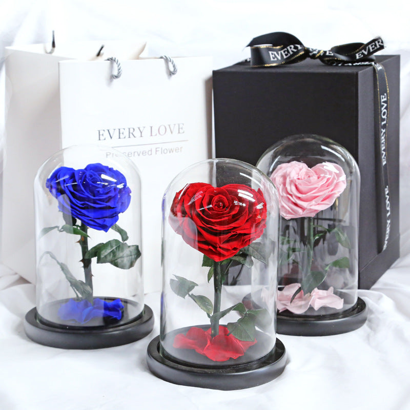 Heart-shaped eternal flowers in a small prince glass-covered gift  preserved flowers with glass dome